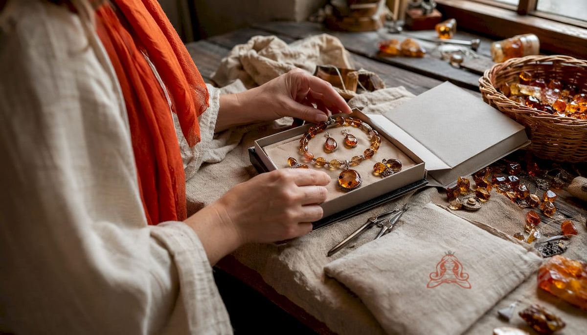 Hands selecting mixed amber jewelry gift set