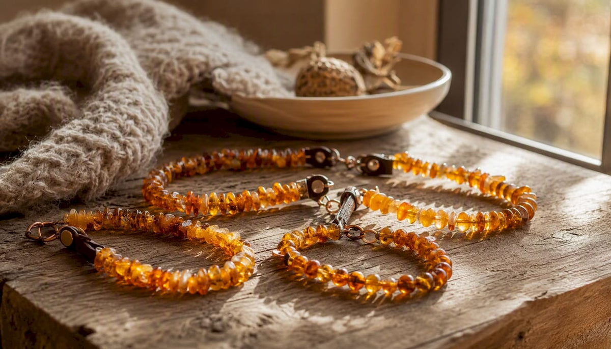 Close-up of amber pet collars on linen